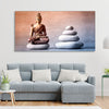 Meditating Buddha is Sitting with Balance Stones Canvas Wall Painting